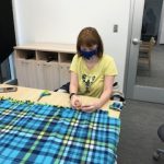 Student creating a blanket